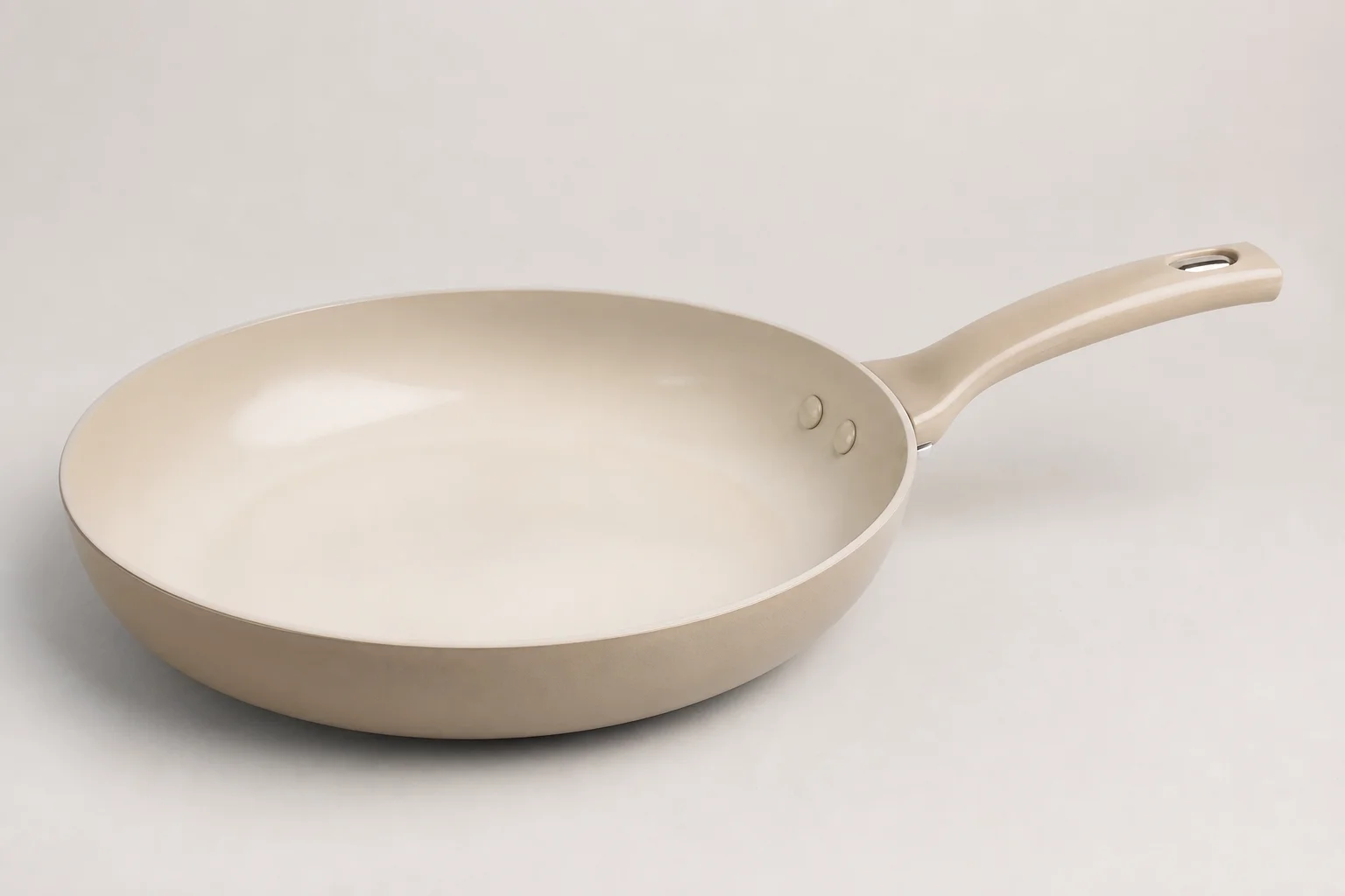 Collection of budget cookware including stainless steel, cast iron, non-stick, and enameled pans