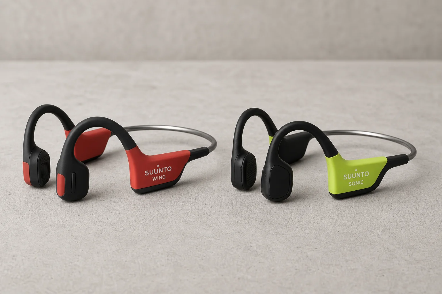 Suunto Wing and Sonic bone conduction headphones on concrete surface