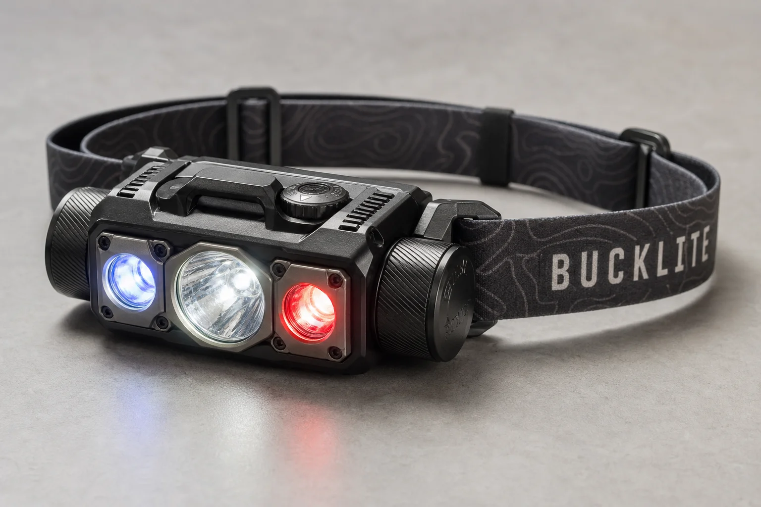Five headlamps displayed on concrete surface showing range from compact to professional models