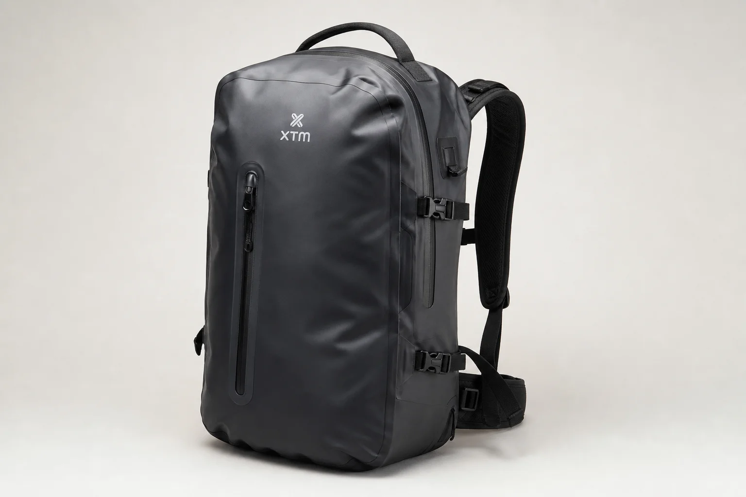 Five waterproof backpacks lined up on concrete surface showing different designs and materials