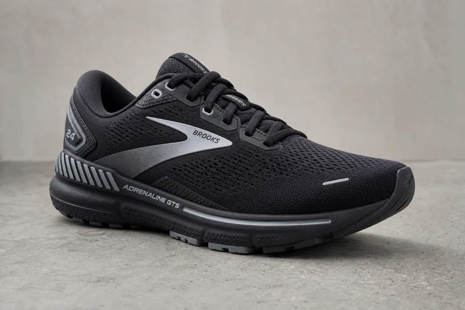 Three running shoes displayed side by side on concrete: Asics Gel Kayano 31, Brooks Ghost 16, and ON Cloudsurfer 7