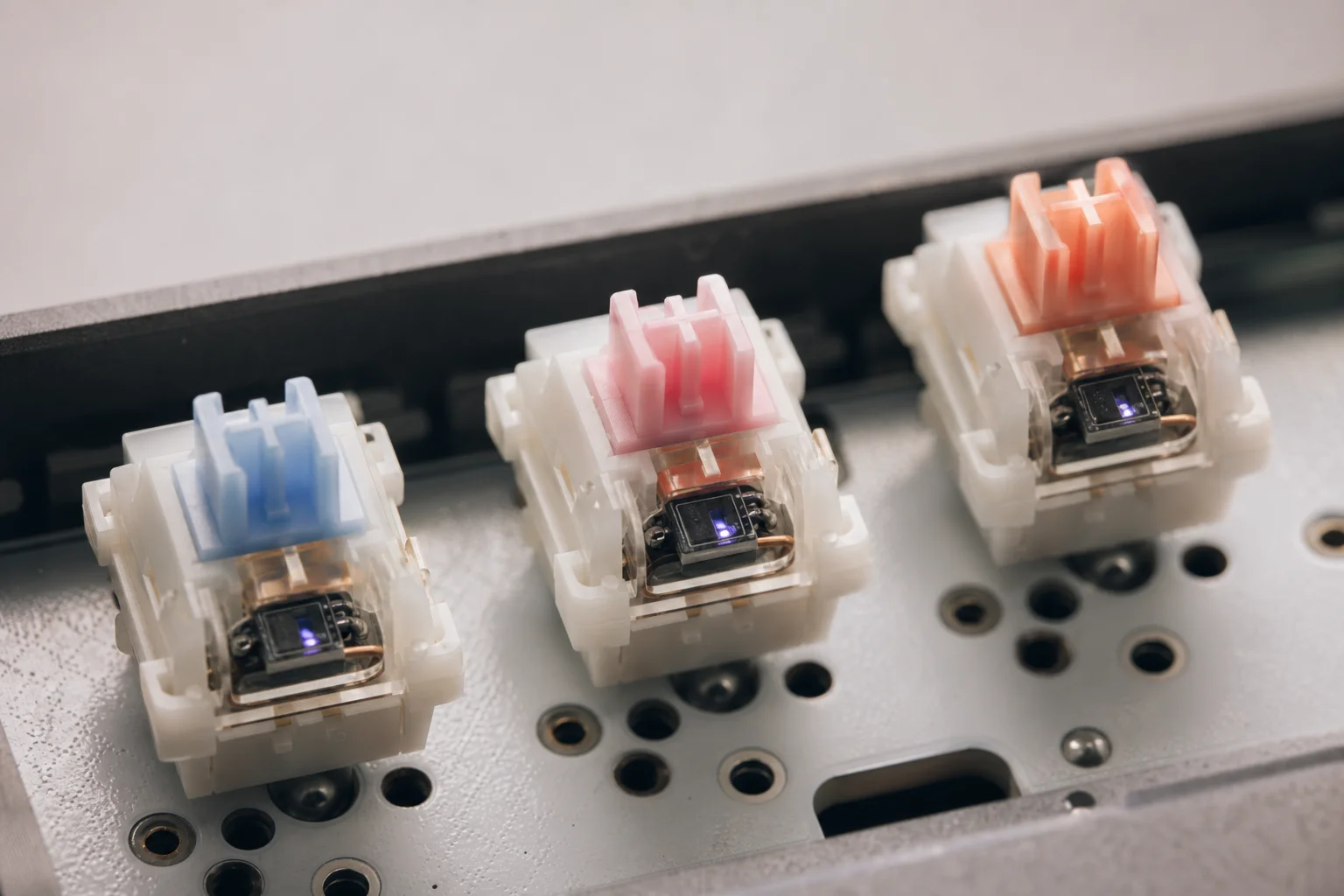 Close-up of mechanical keyboard switches showing Hall Effect sensor design
