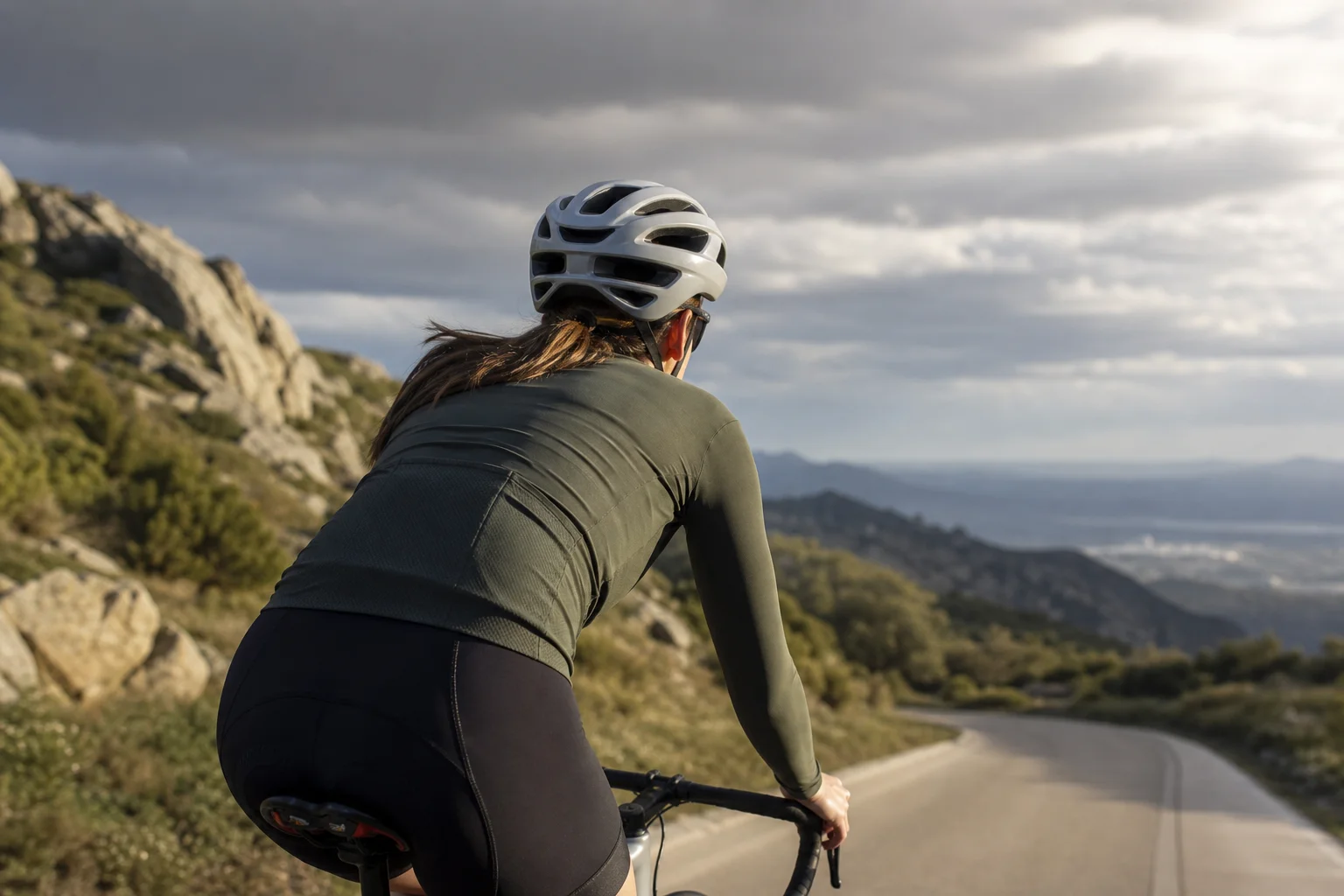 Cyclist riding in varied light conditions showing helmet ventilation