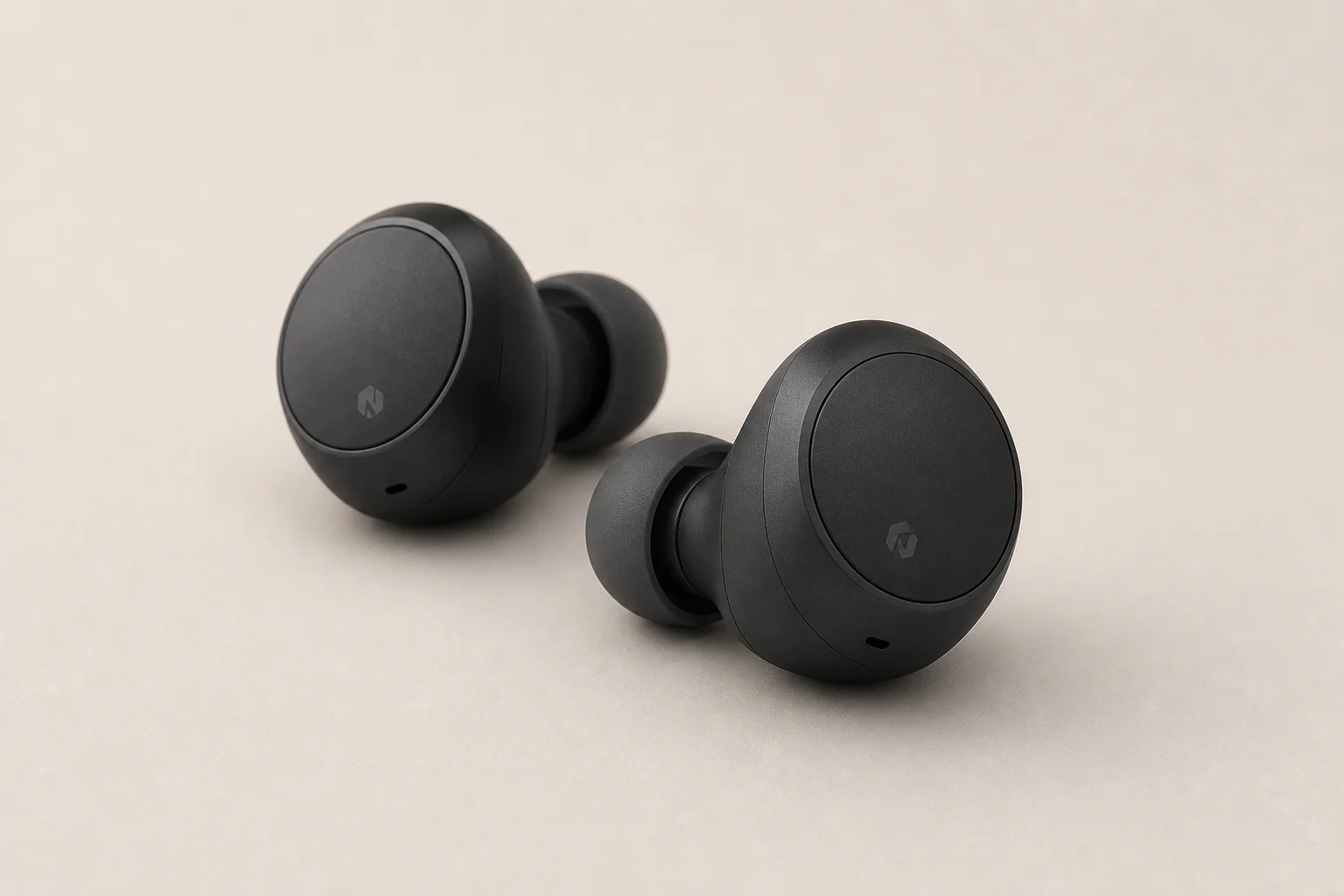 Nine earbud models arranged on concrete surface representing budget to premium options