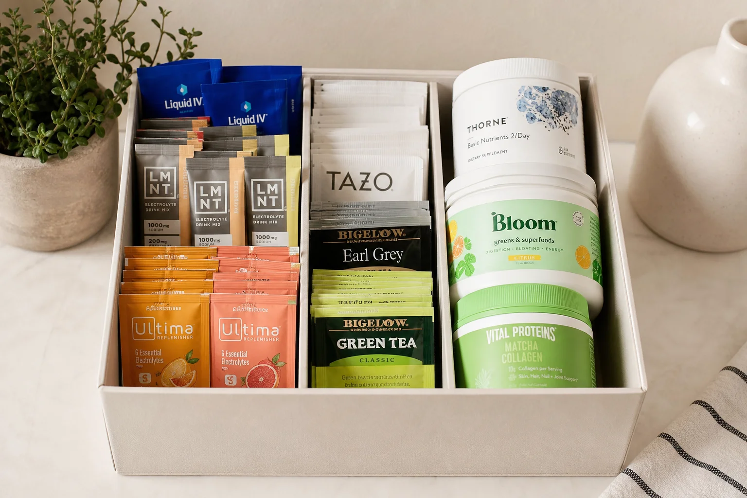 Electrolyte packets and tea sachets organized in a storage container