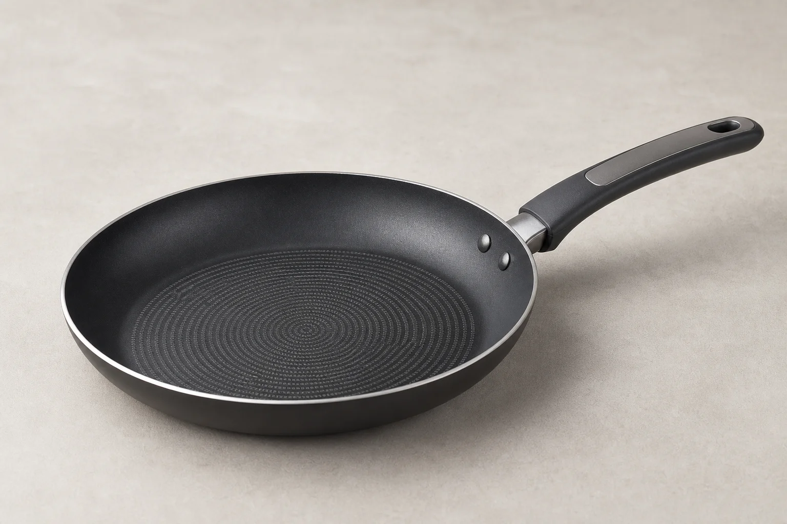 Collection of budget cookware including stainless steel, cast iron, non-stick, and enameled pans