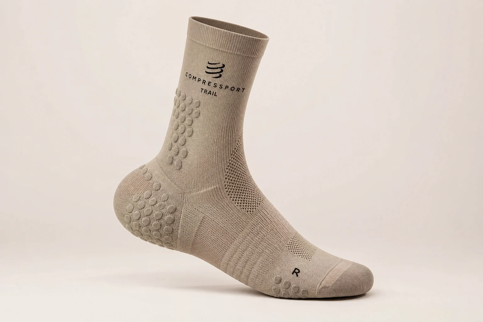 Collection of running socks in various colors and styles arranged on concrete surface