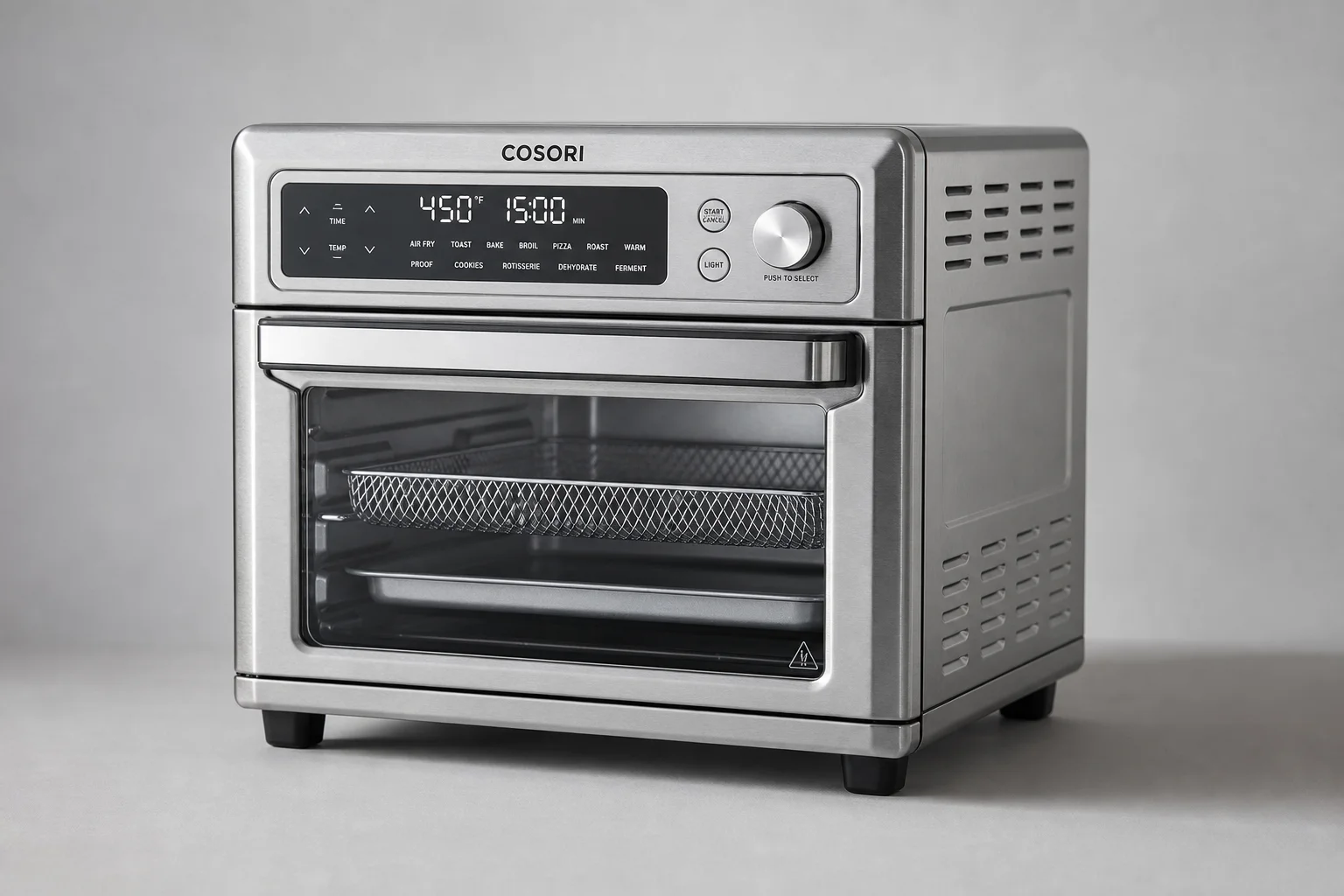 Three air fryer toaster ovens lined up on concrete surface