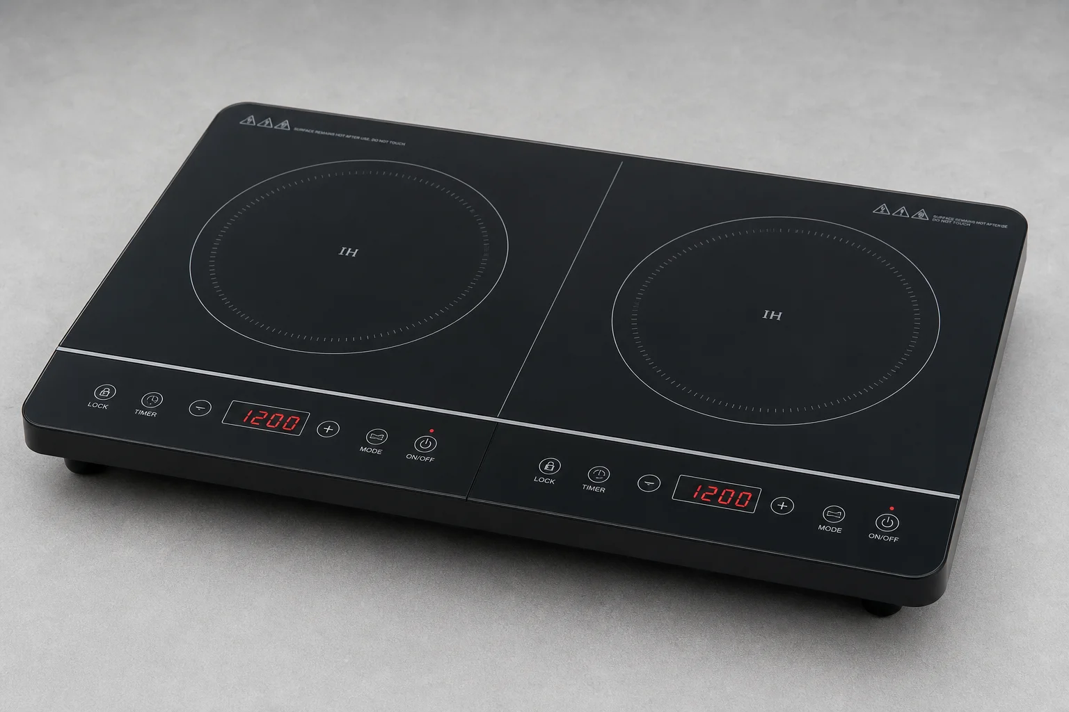 Five portable electric stoves displayed on grey concrete surface