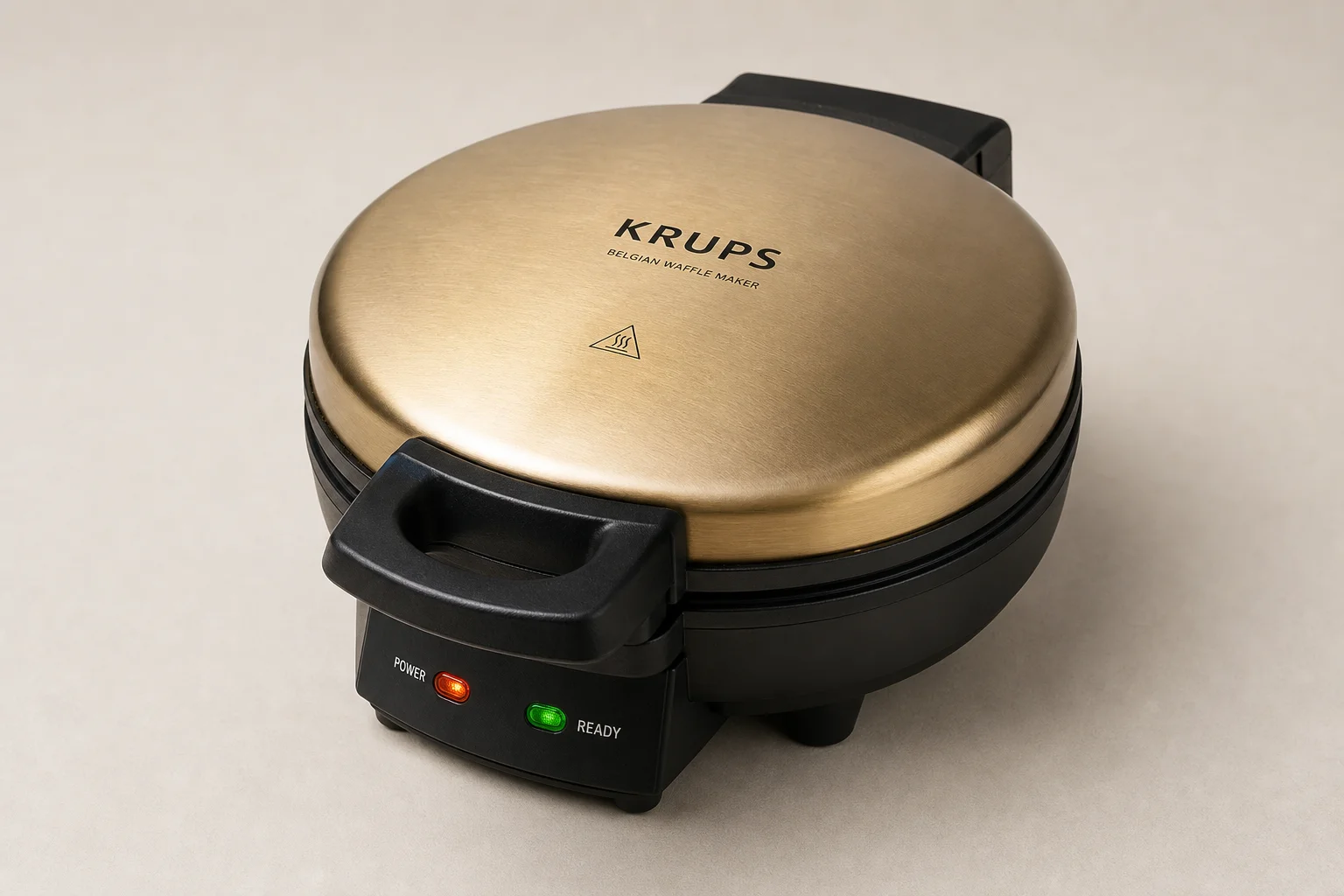 Five Cuisinart waffle makers arranged on concrete surface from budget to premium models