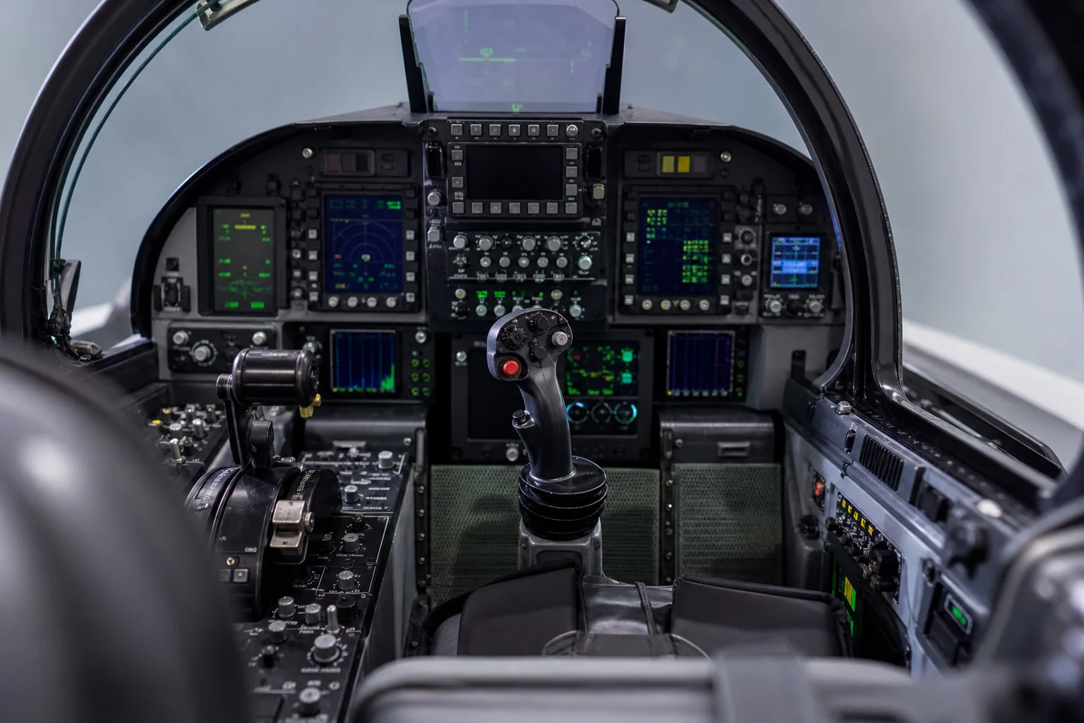 Fighter jet cockpit interior with instrument panel and control stick