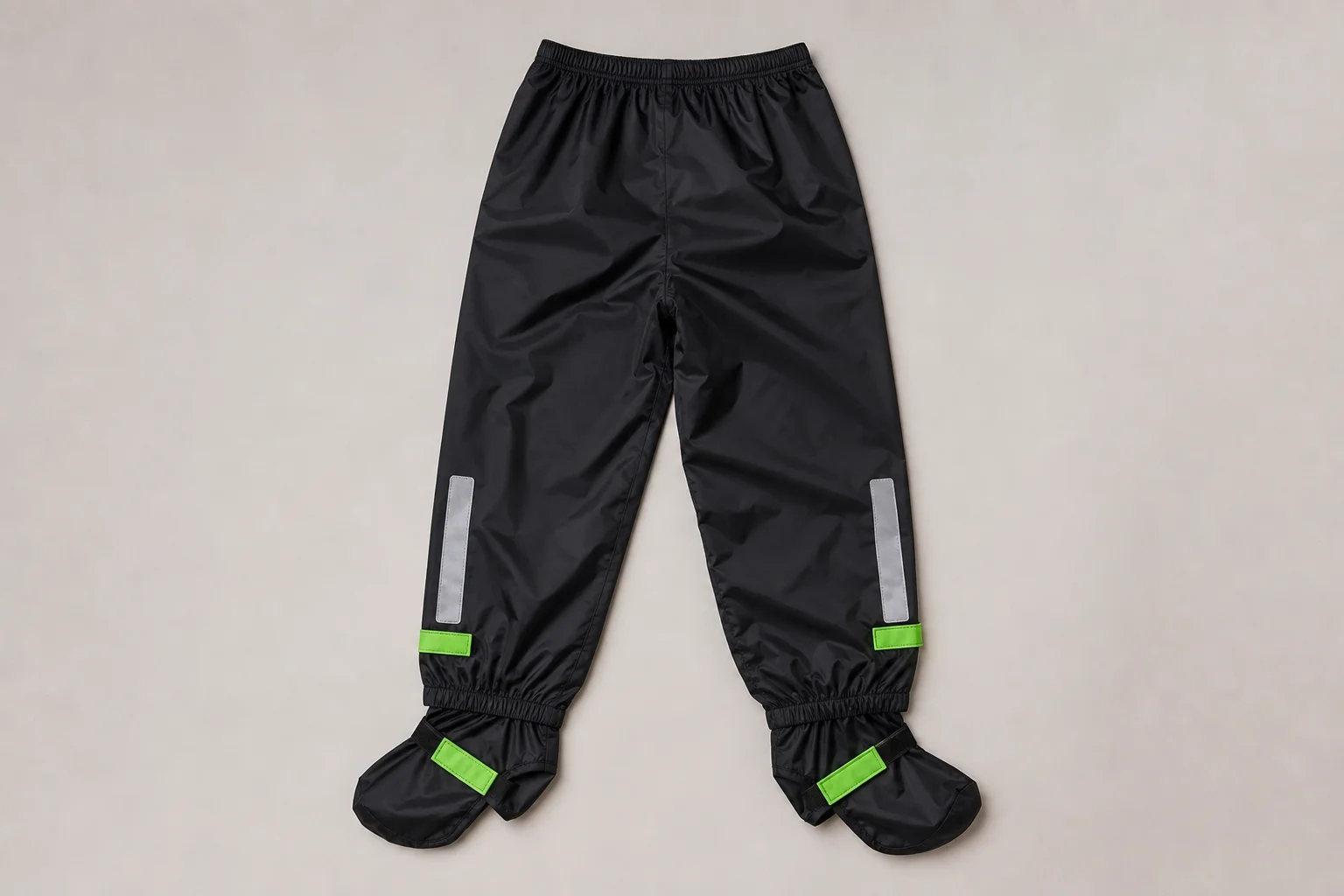 Five Decathlon rain jackets and pants displayed on neutral backdrop