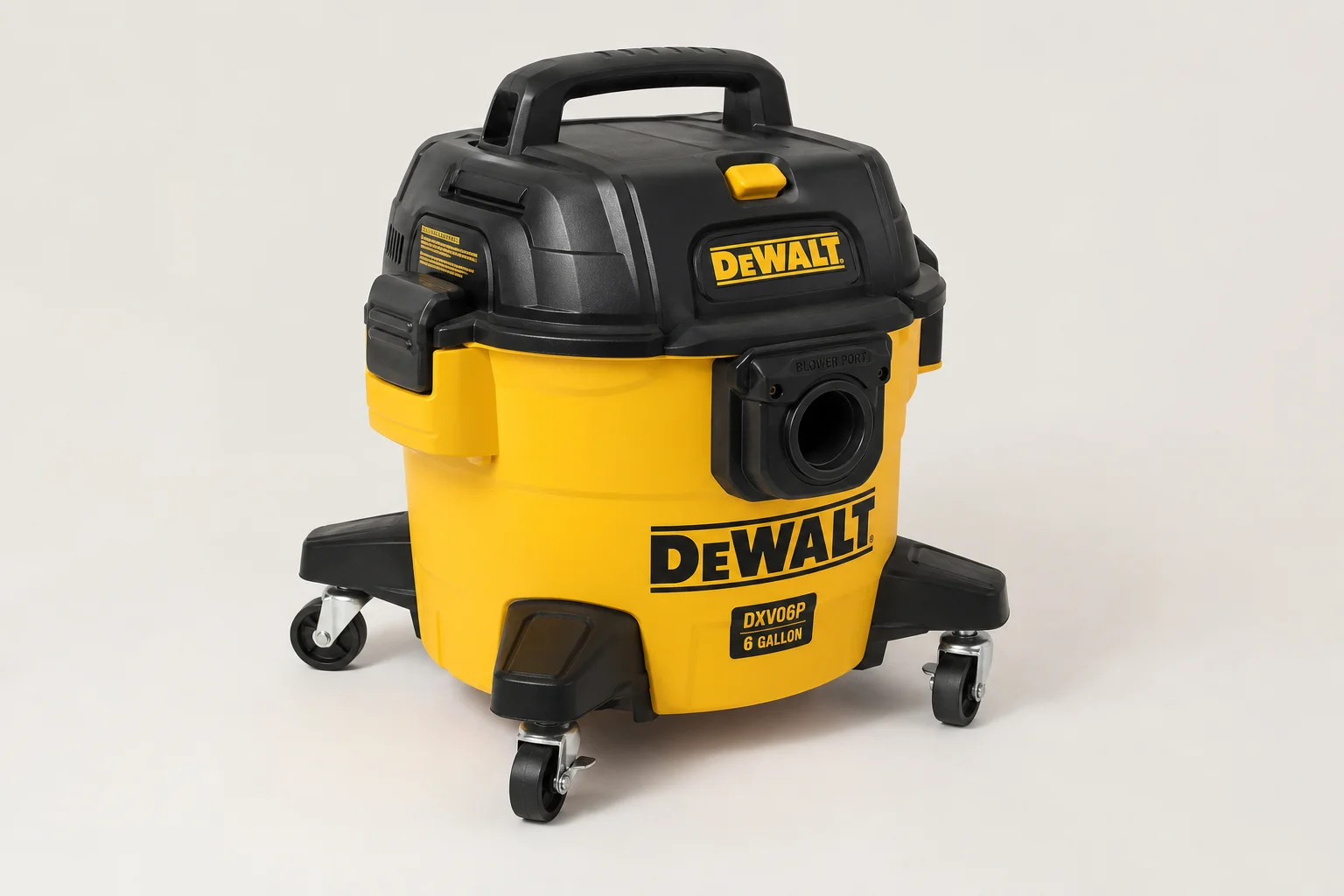 Five shop vacuums of varying sizes arranged on a concrete workshop floor