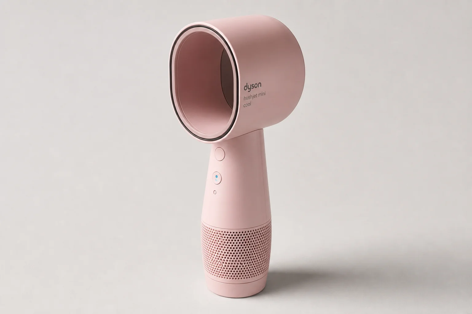 Pink Dyson HushJet Mini Cool handheld fan on neutral grey backdrop