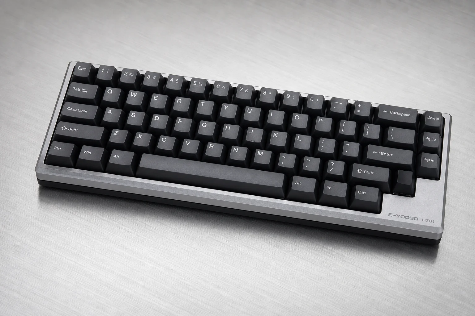 Six budget mechanical keyboards arranged on concrete surface showing variety of styles and colors