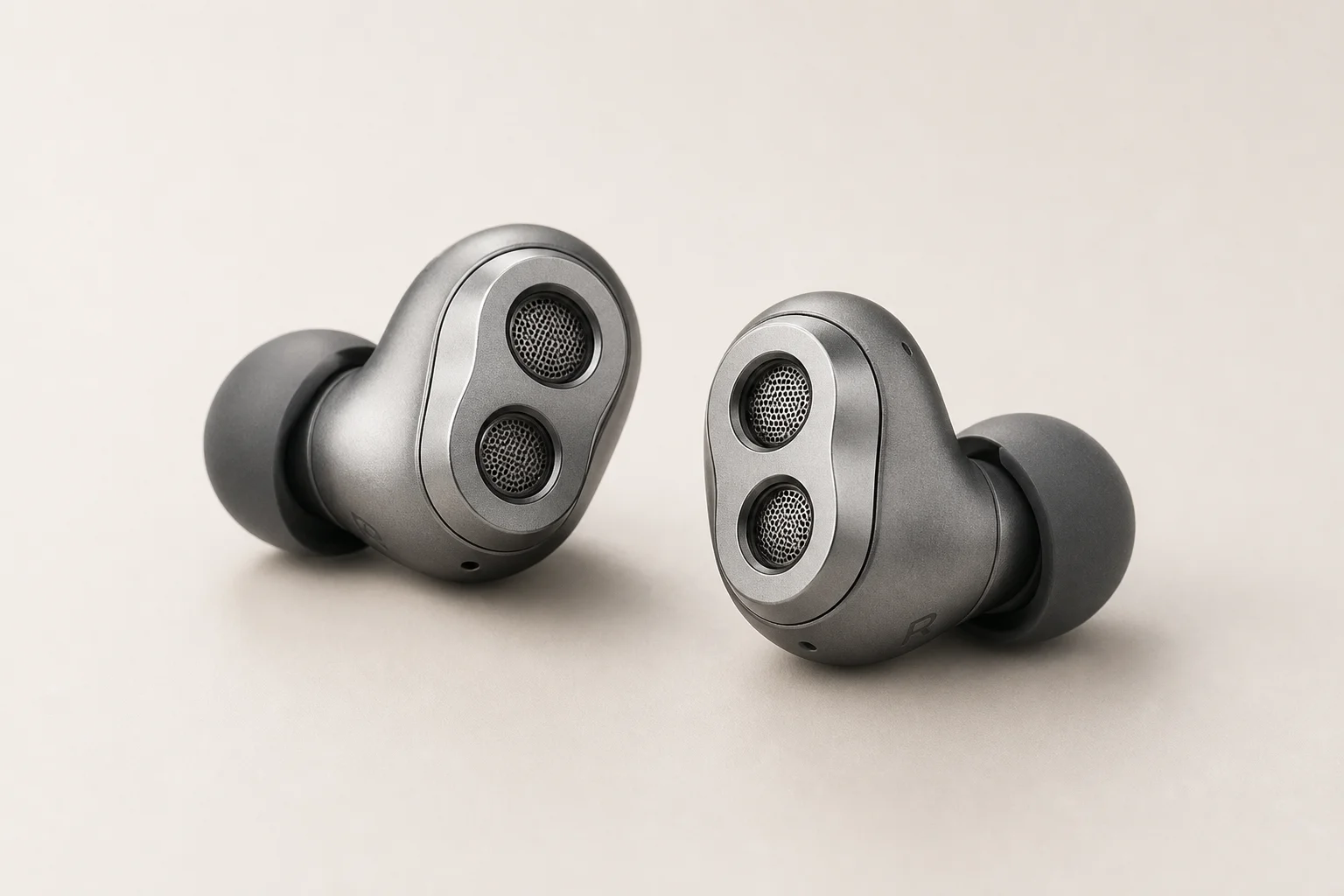 Nine earbud models arranged on concrete surface representing budget to premium options