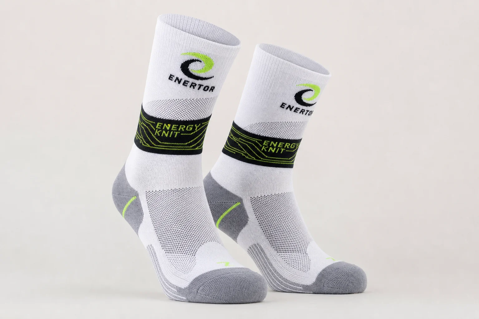 Collection of various running socks in different colors and styles on neutral backdrop
