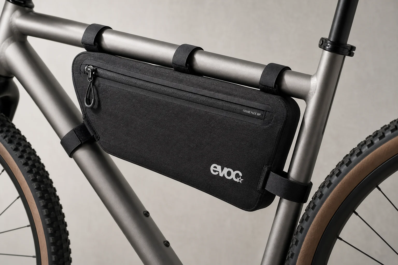 Fully loaded trail bike with Old Man Mountain racks and bags on neutral backdrop