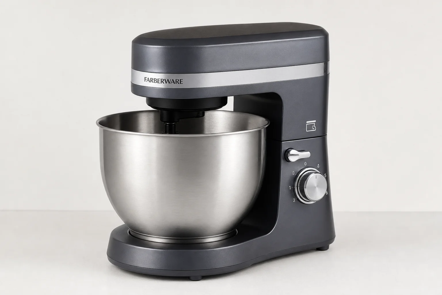 Four stand mixers in different sizes and styles arranged on a neutral backdrop