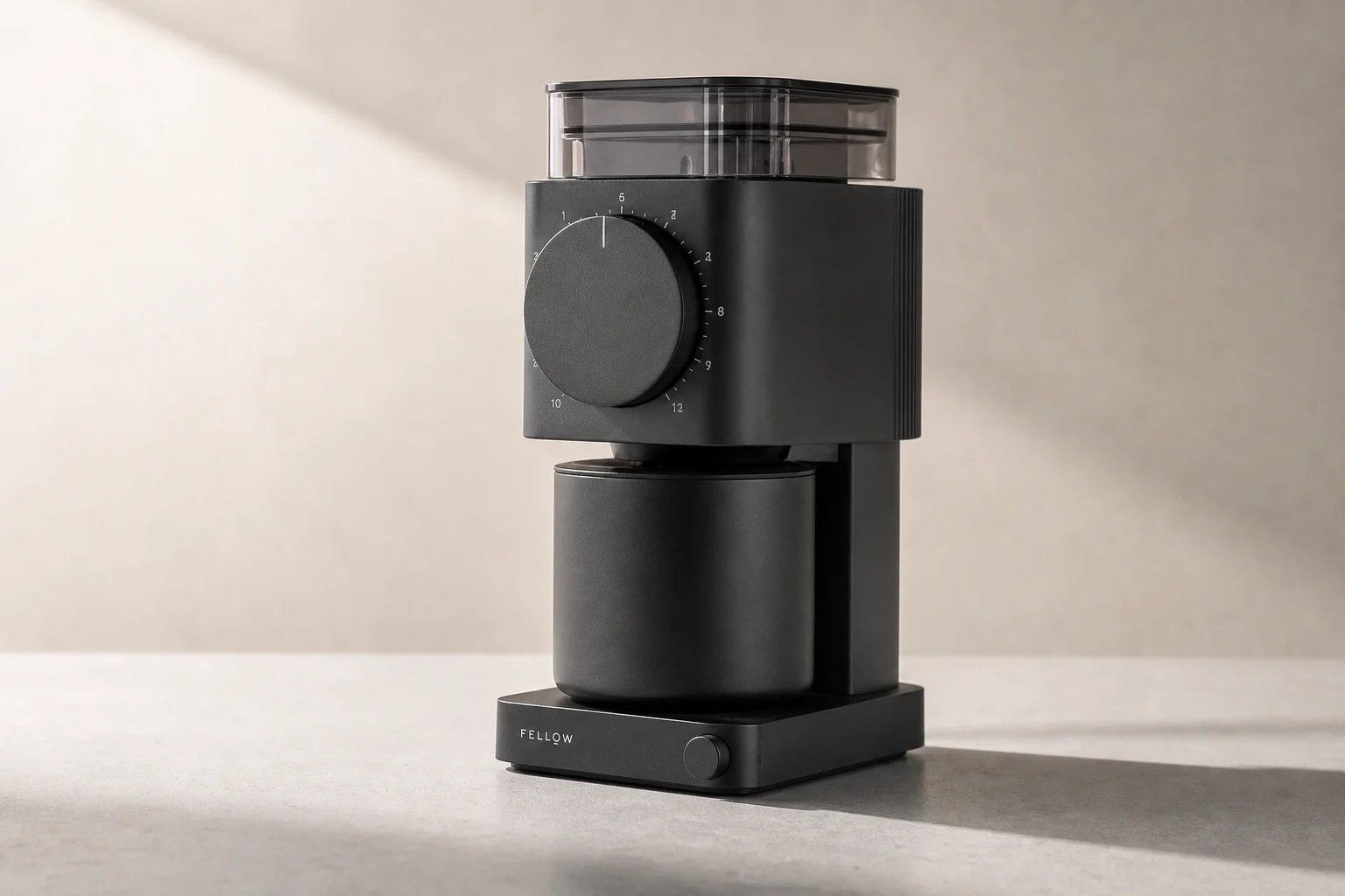 Fellow Ode 2 coffee grinder on matte concrete surface