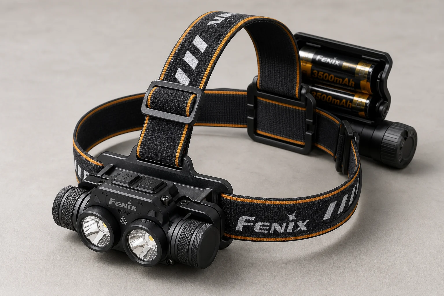 Five headlamps displayed on concrete surface showing range from compact to professional models