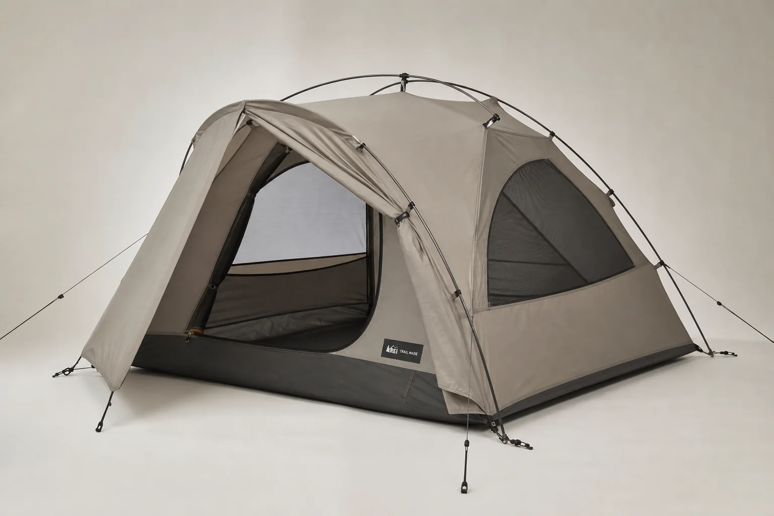 Seven survival tents of varying sizes and styles arranged on neutral backdrop