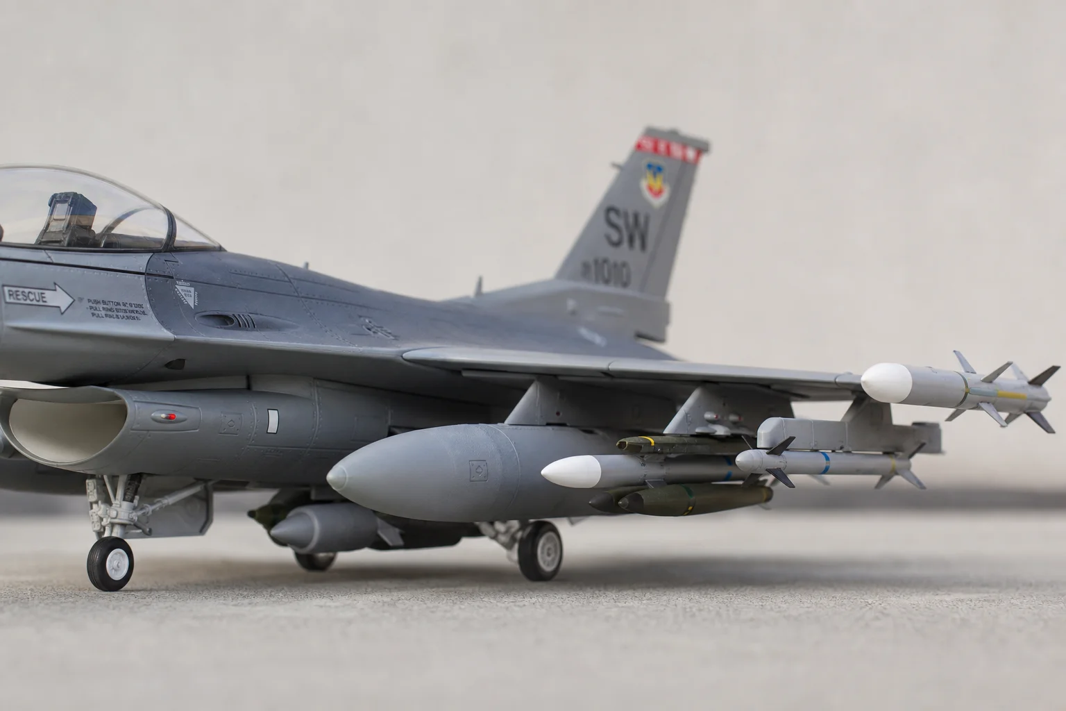 Close-up of RC jet with mounted scale rocket armament details
