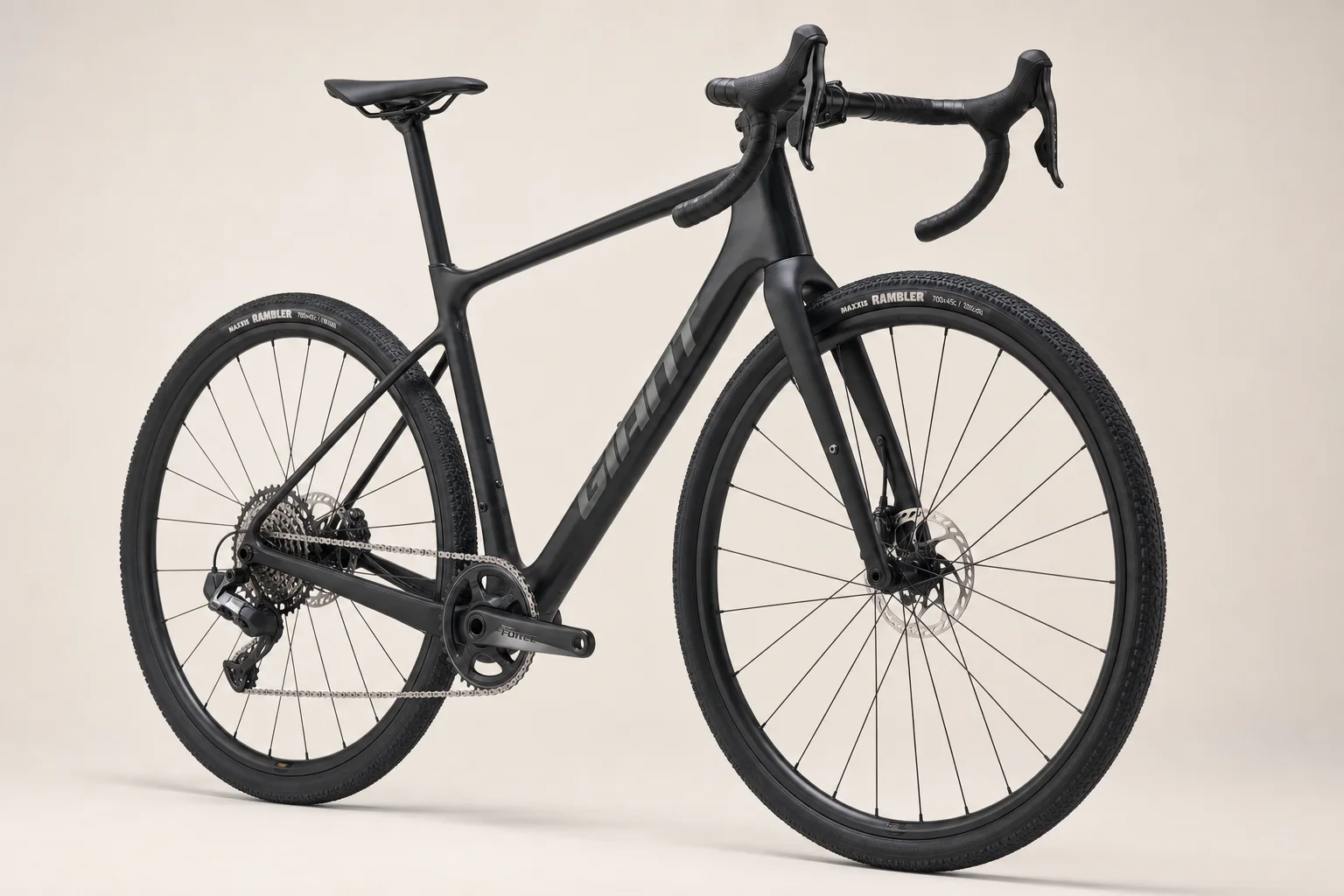Five gravel bikes for bikepacking arranged on concrete surface