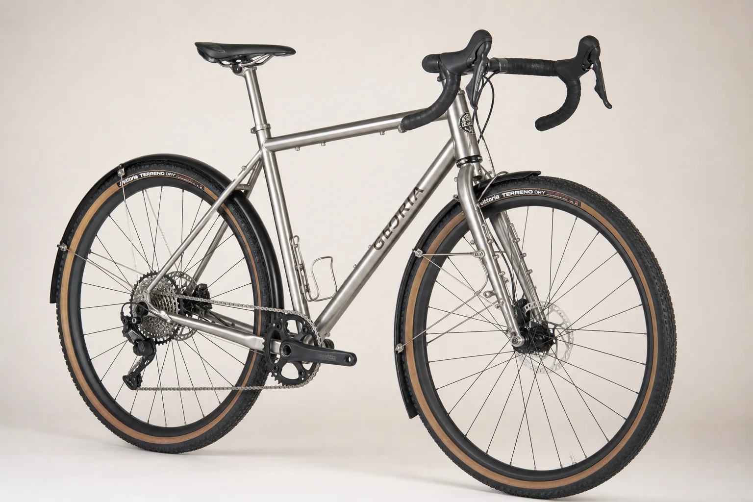 Multiple allroad bikes displayed on neutral backdrop showing different frame materials and designs