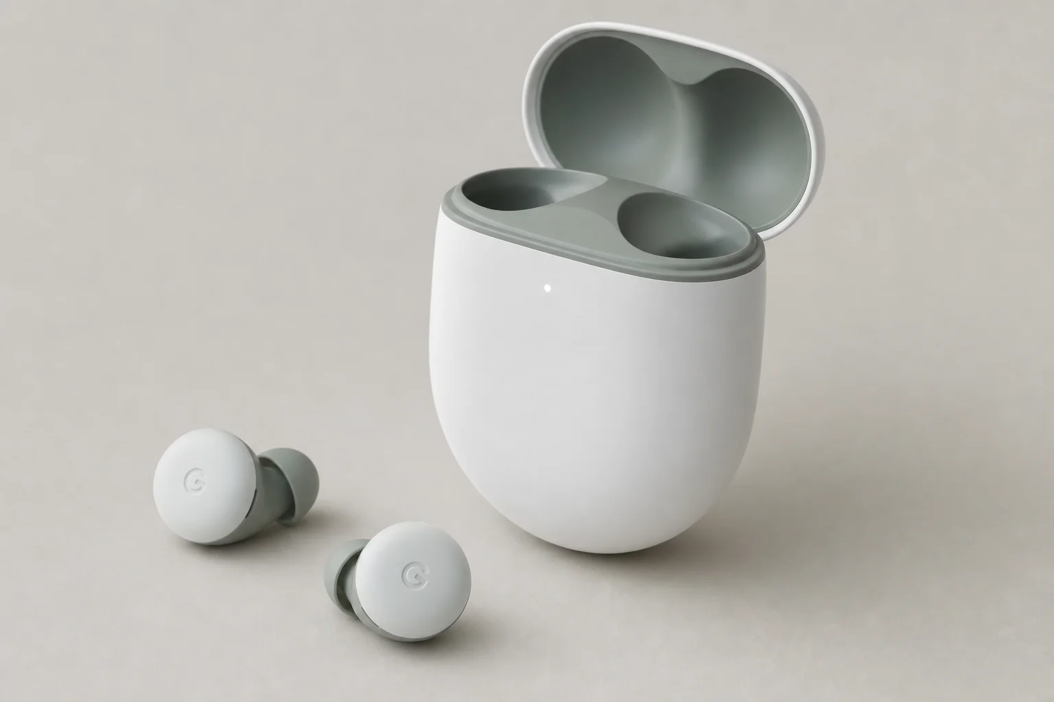 Collection of 12 true wireless earbuds arranged on concrete surface