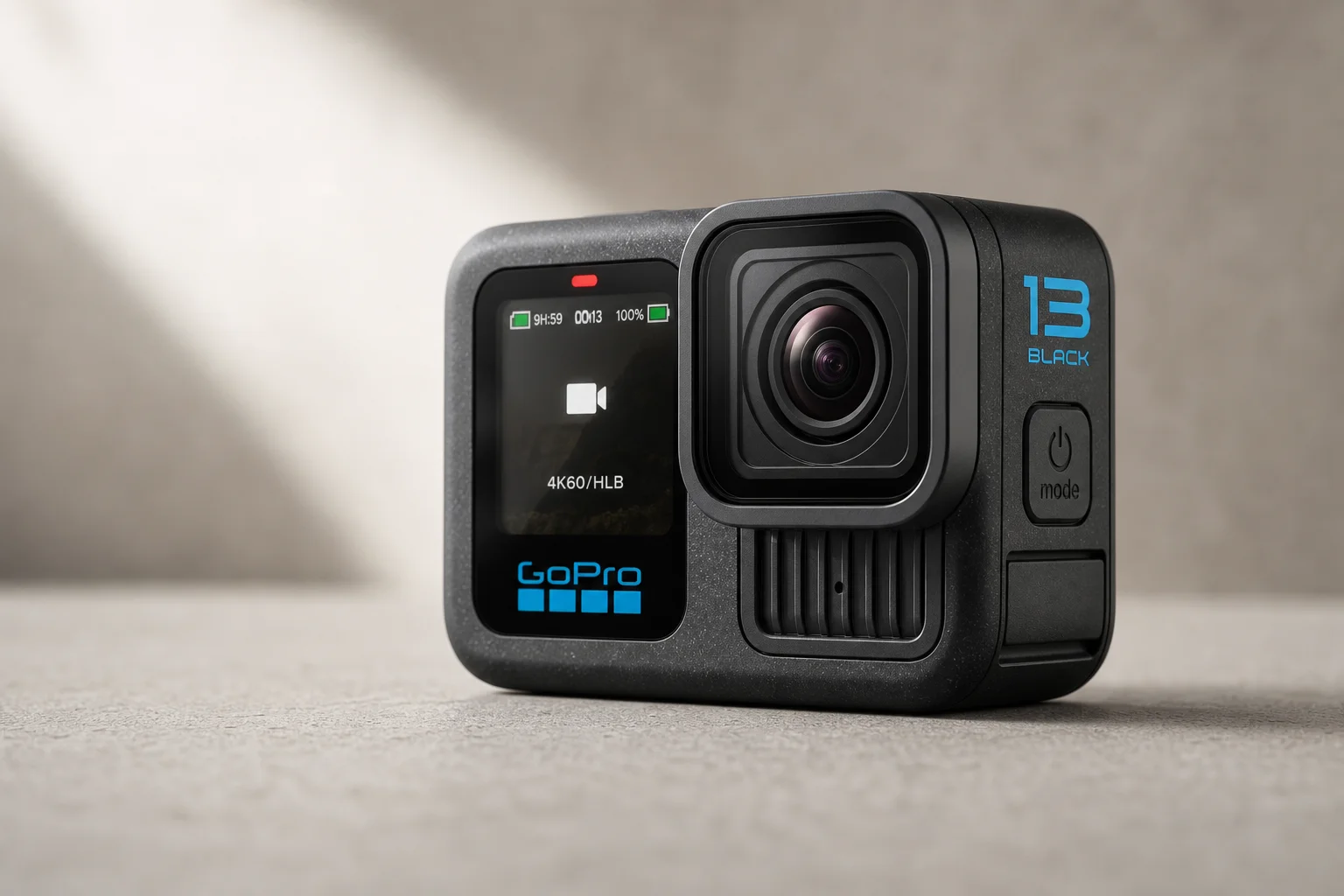 GoPro HERO13 Black action camera on matte concrete surface