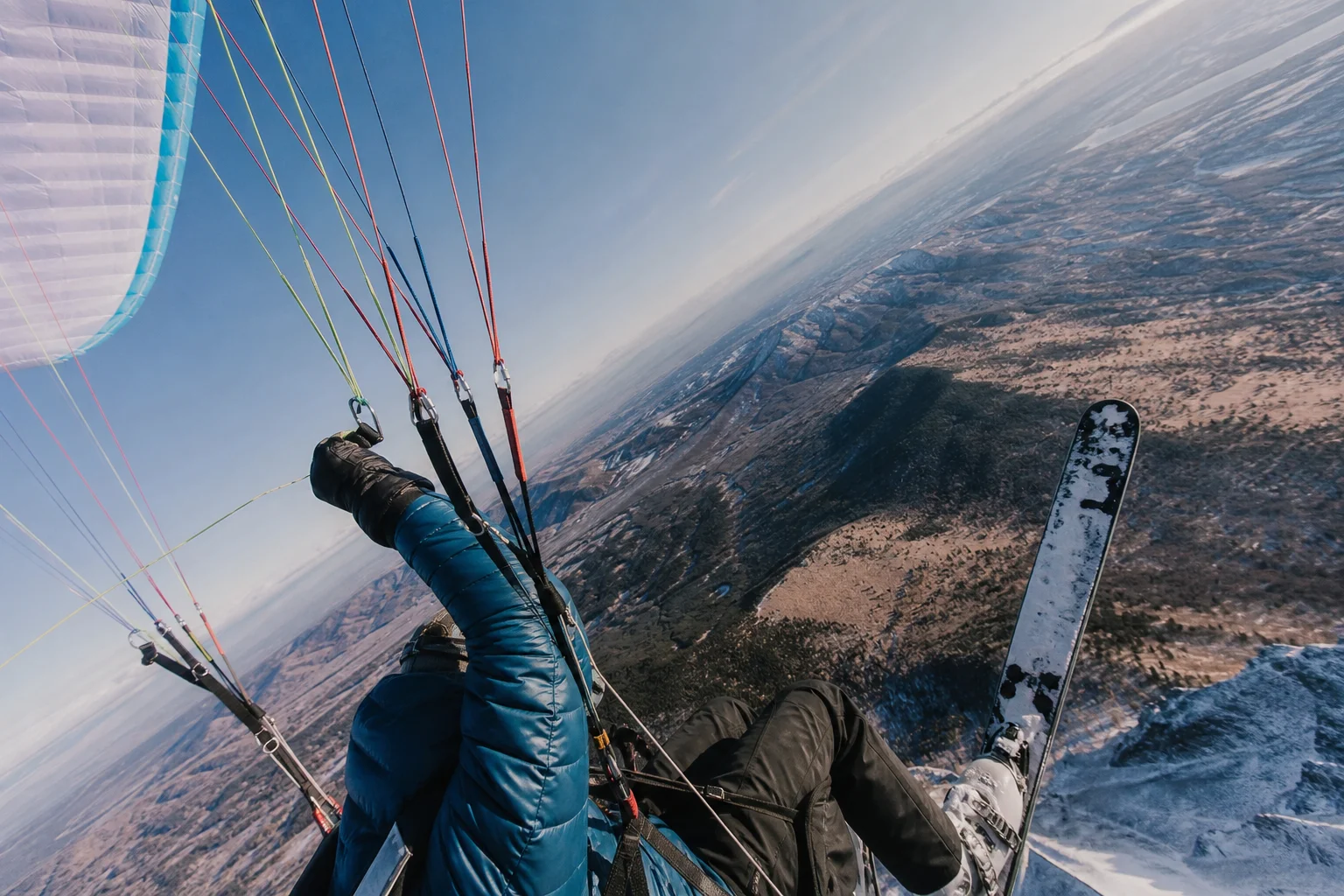Action sports athlete performing aerial maneuver with mounted camera