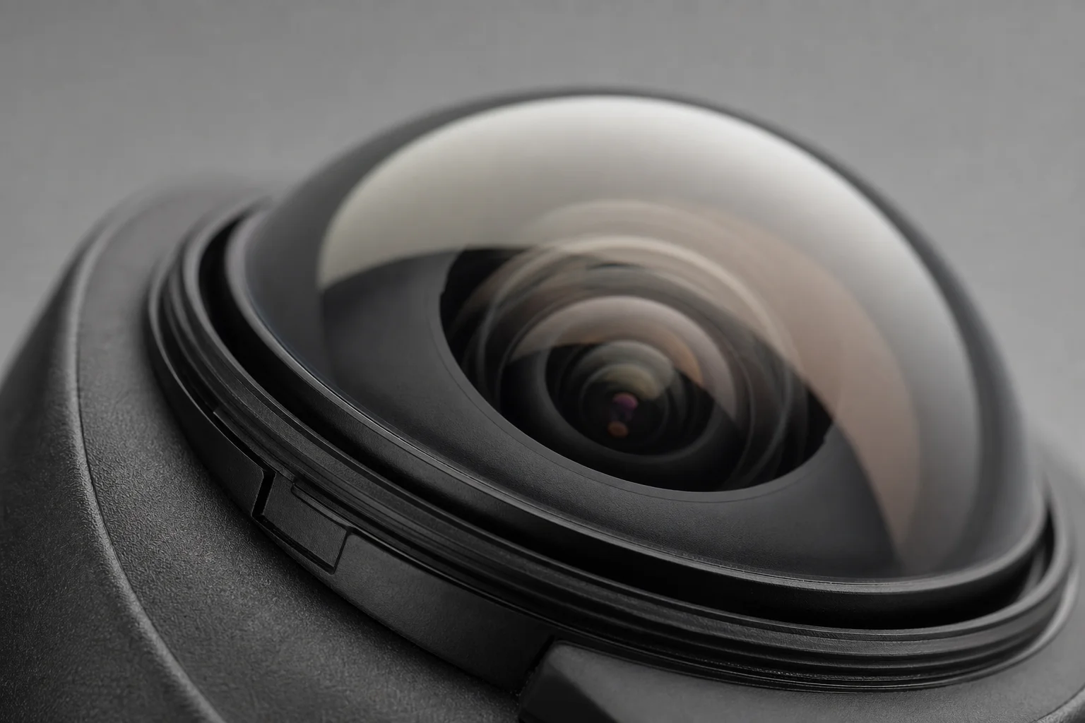 Close-up of camera lens assembly showing replaceable glass lens cover