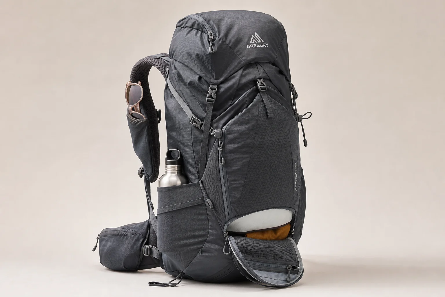 Eight backpacking packs of various styles and sizes arranged on concrete surface