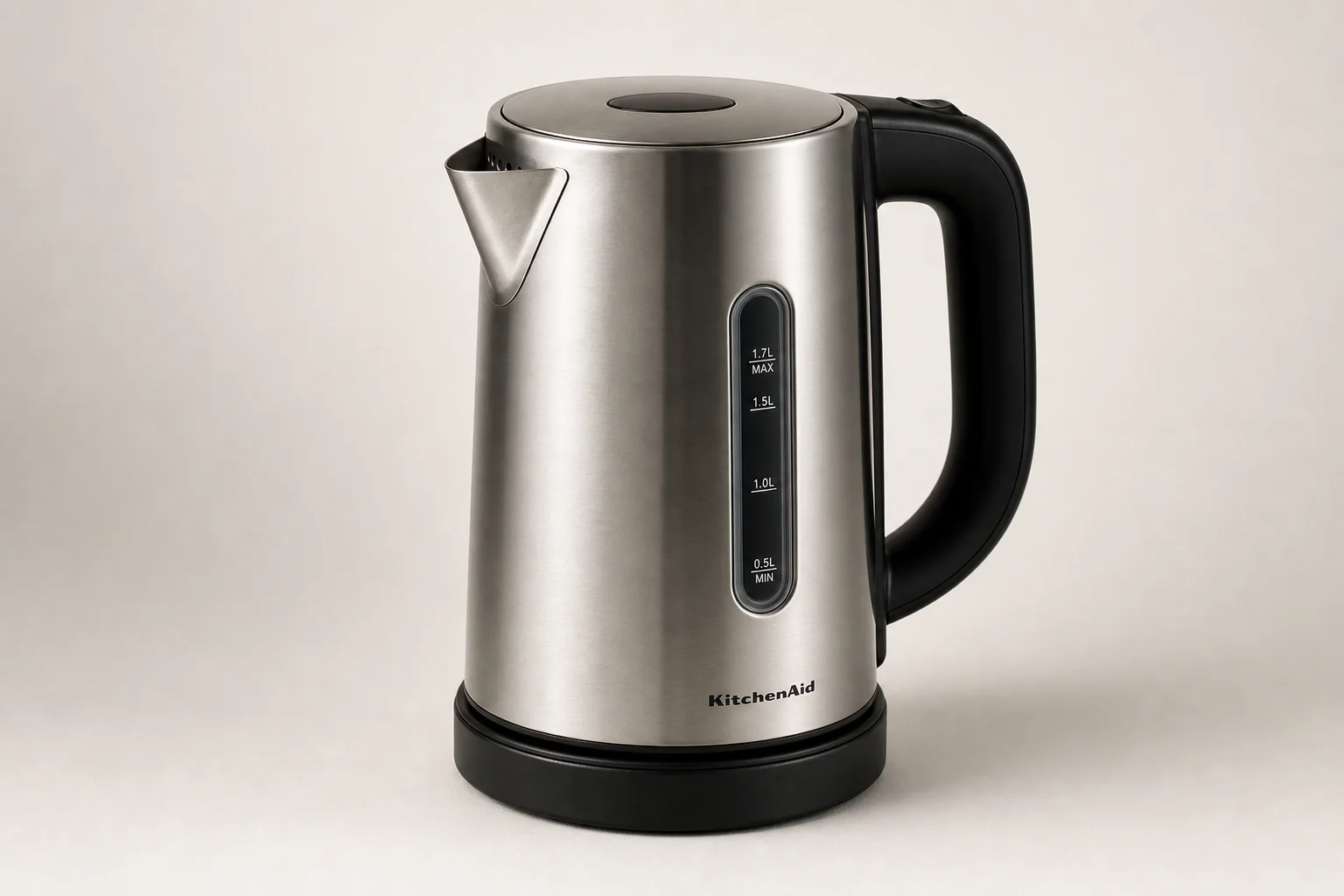 Five electric kettles in descending order of ranking on a concrete surface