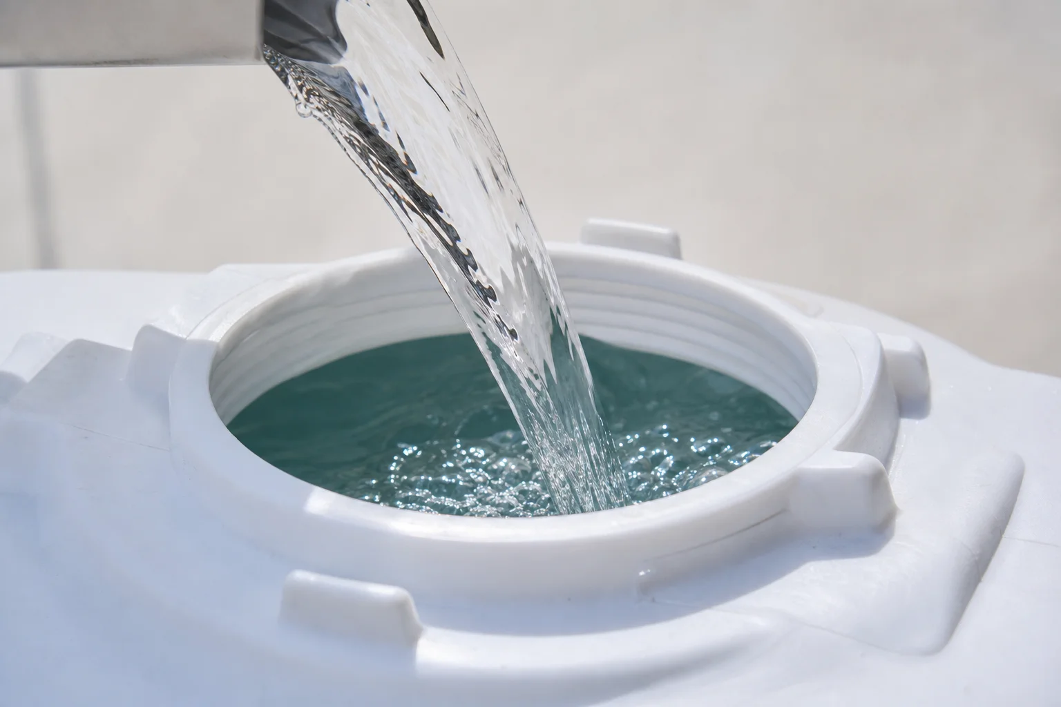 Water tank being filled with purified water into a garment steamer
