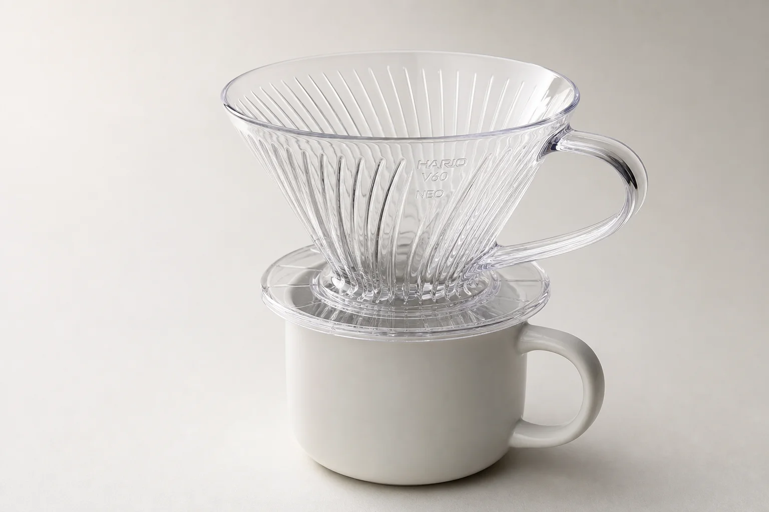 Hario V60 NEO dripper in clear Tritan material on white ceramic cup