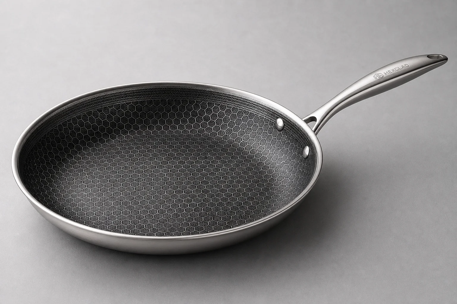 Five cookware brands displayed together on neutral backdrop