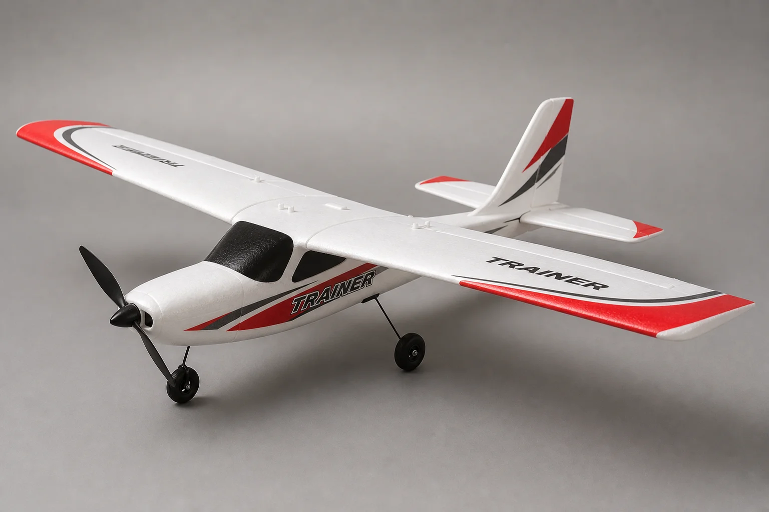 Five beginner RC planes displayed on neutral backdrop