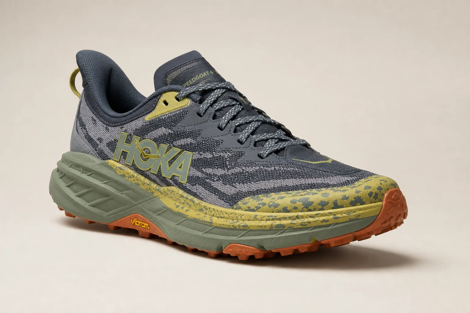 Three Hoka trail shoes displayed on concrete: Speedgoat 6, Challenger 7, and Stinson 7