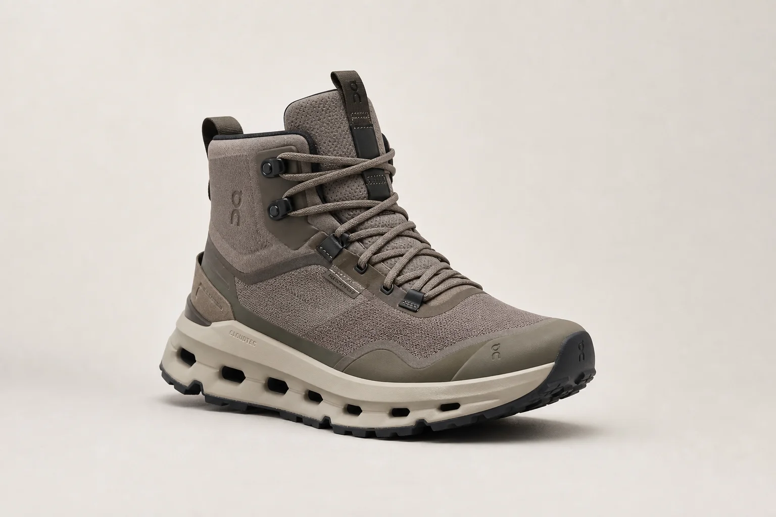 Collection of diverse winter boots arranged on concrete surface