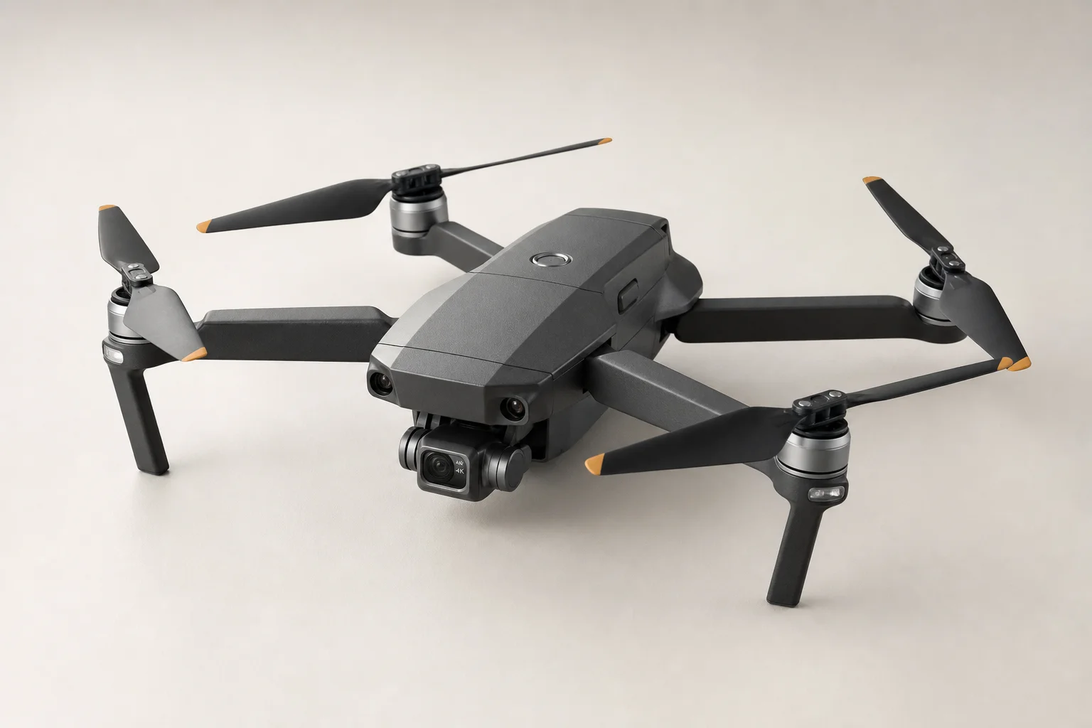 Five budget drones arranged on grey concrete surface