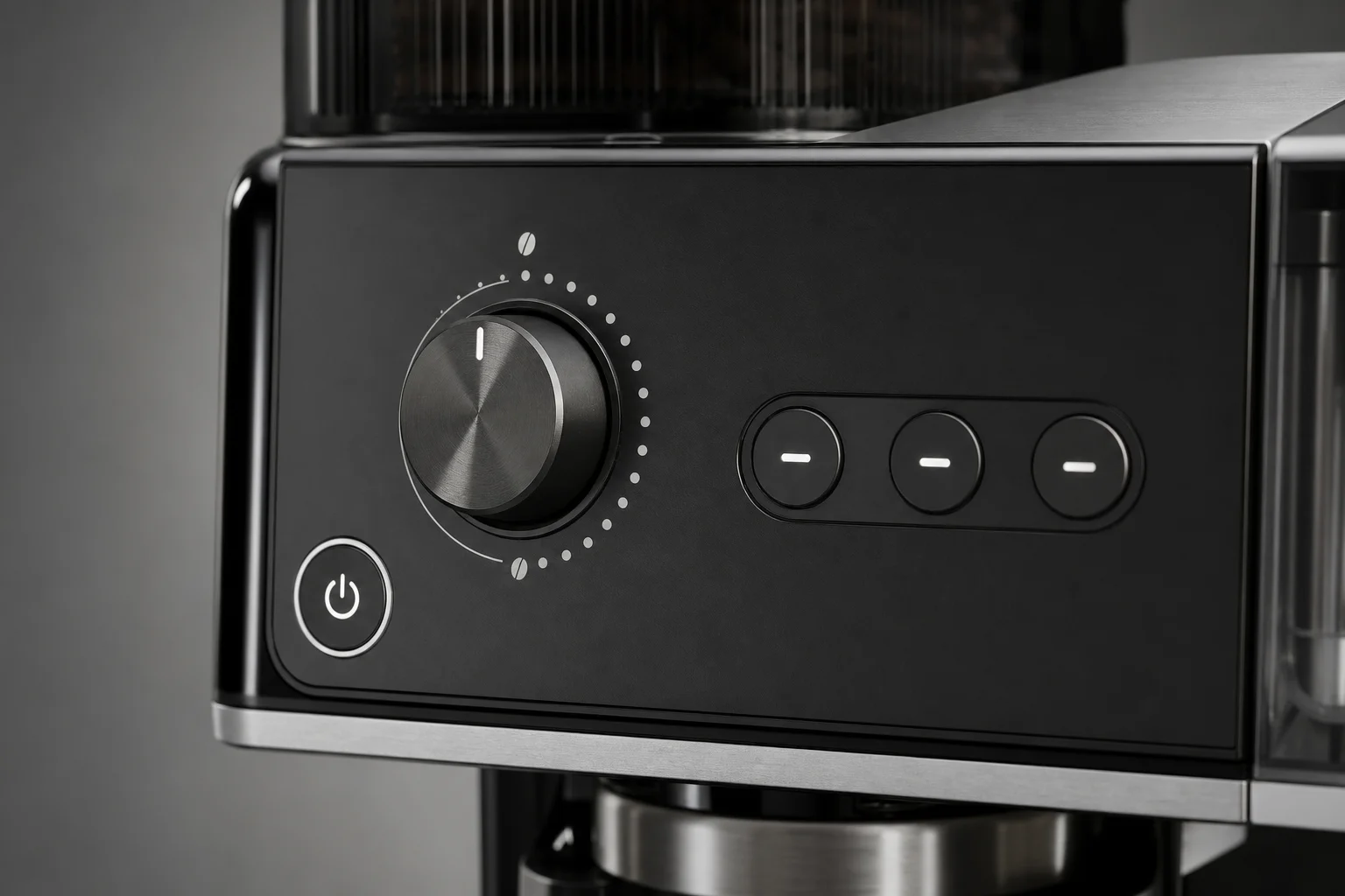 Close-up of coffee machine control panel with power button and dials