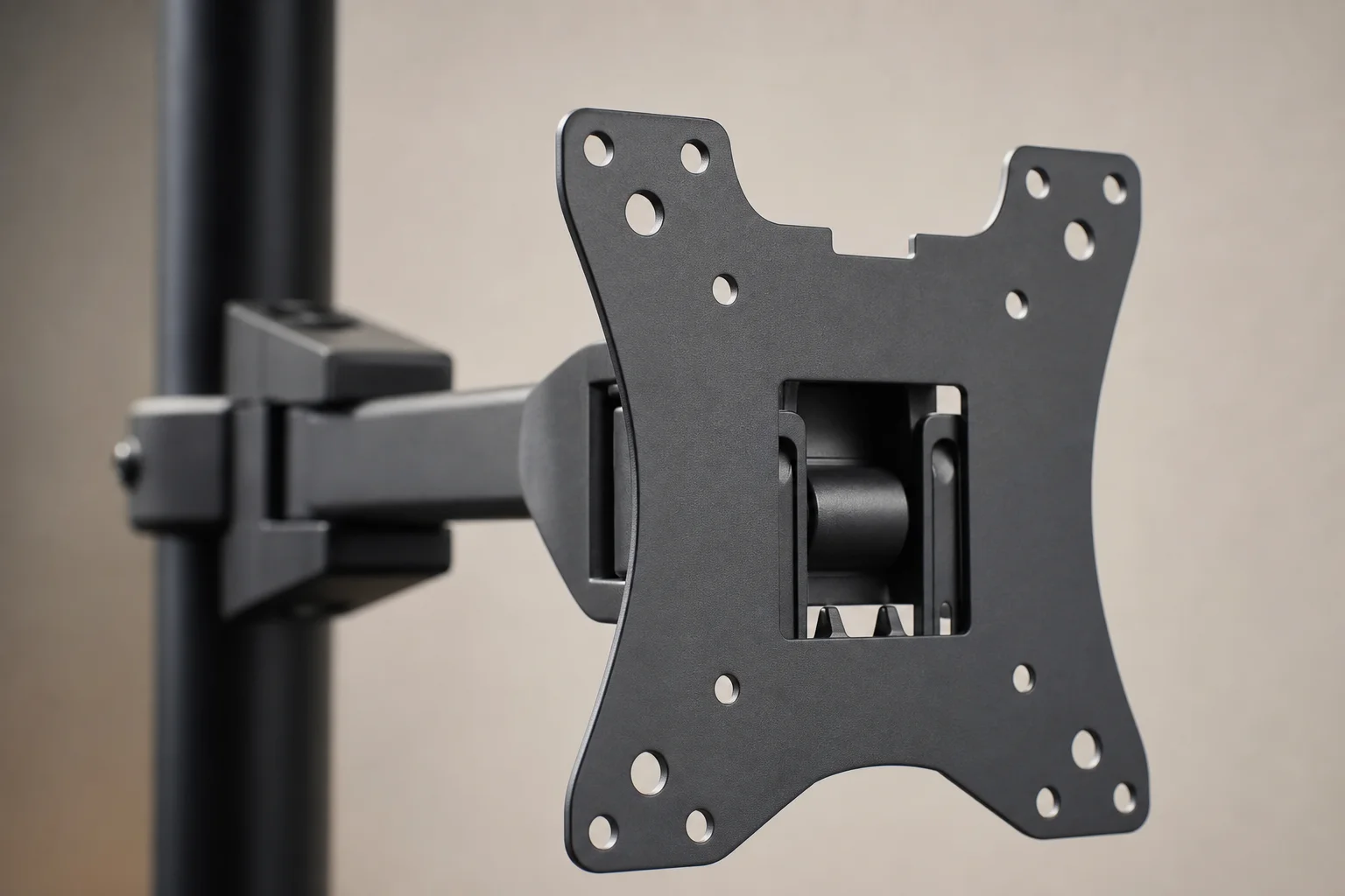 Close-up of monitor plate attachment mechanism with VESA mounting holes