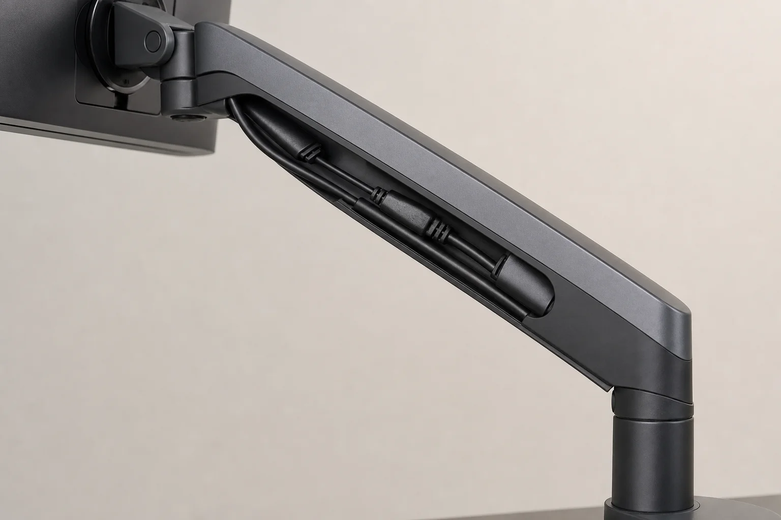 Cable management raceway system integrated along monitor arm