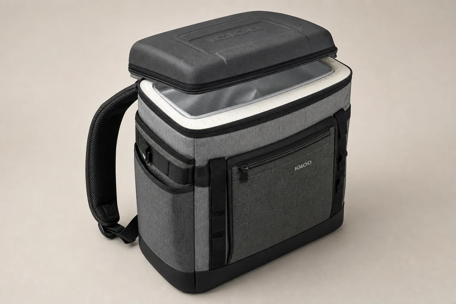 Five cooler backpacks in various styles arranged on concrete surface