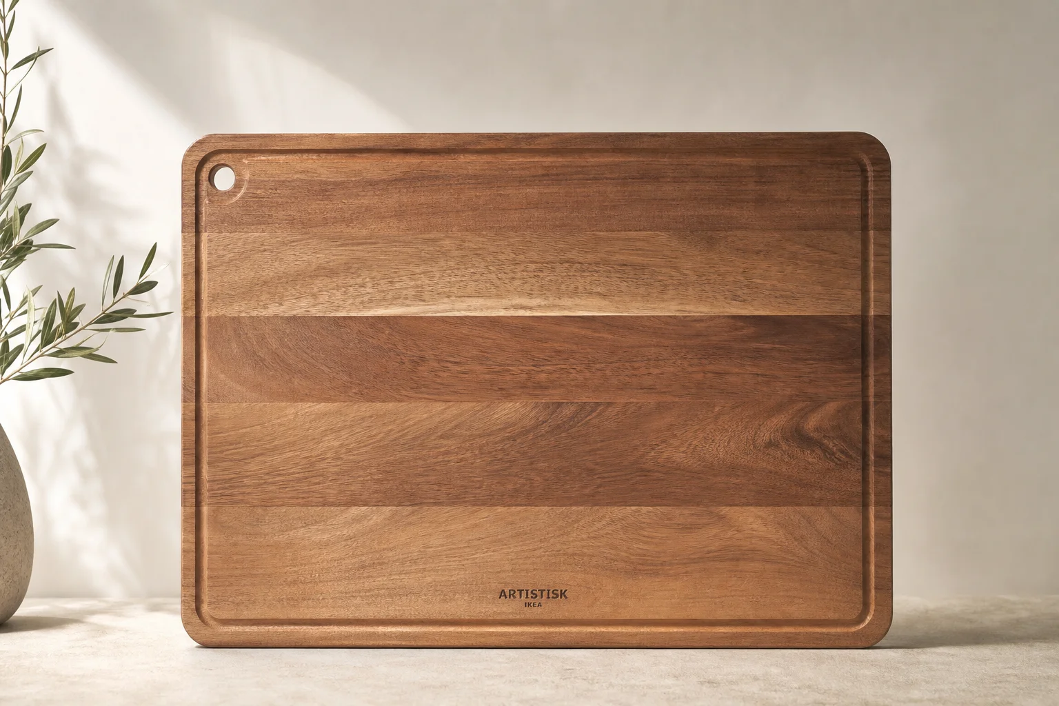Collection of IKEA camping products including bowls, cutting boards, storage bags, and accessories on concrete