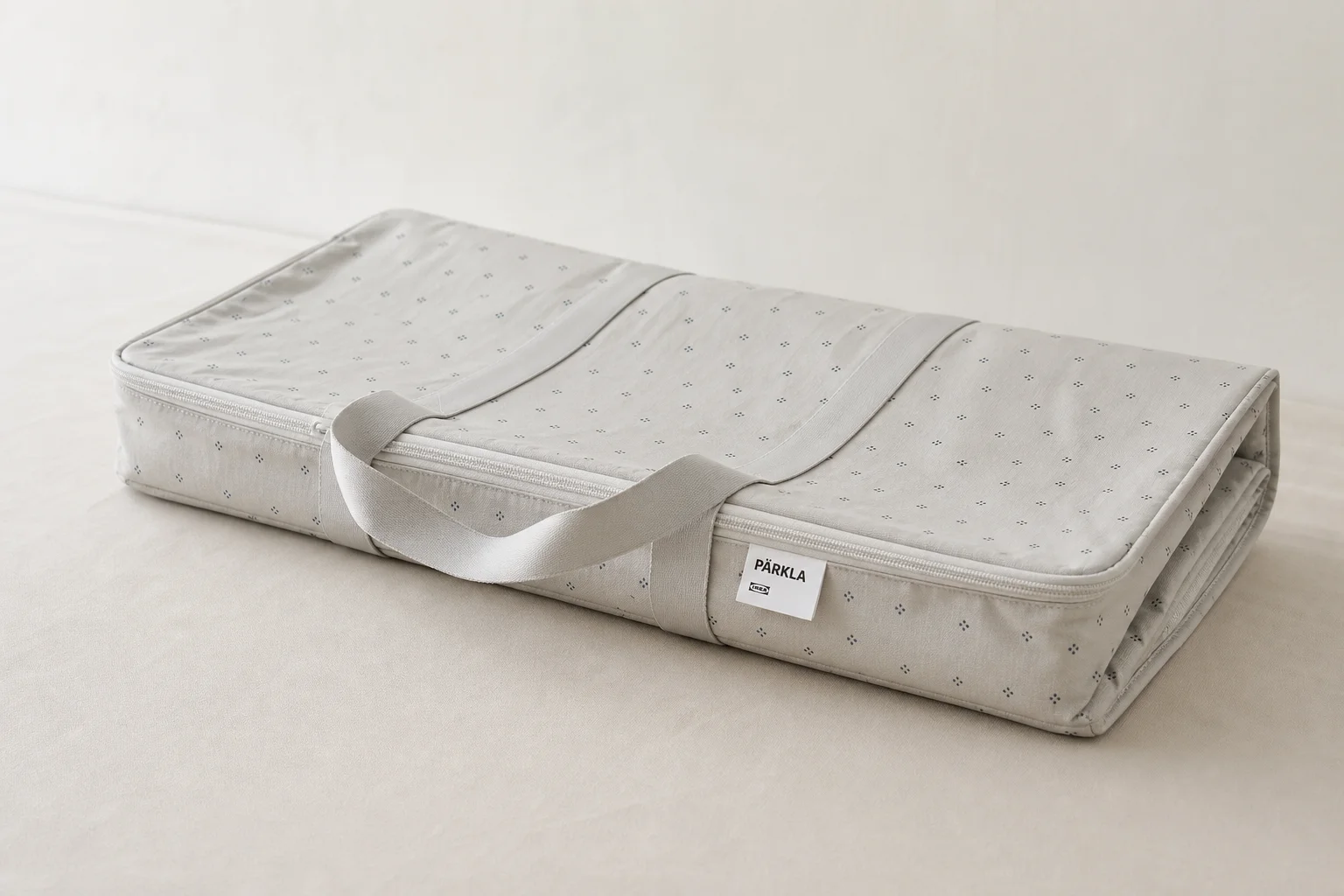 Collection of IKEA camping products including bowls, cutting boards, storage bags, and accessories on concrete