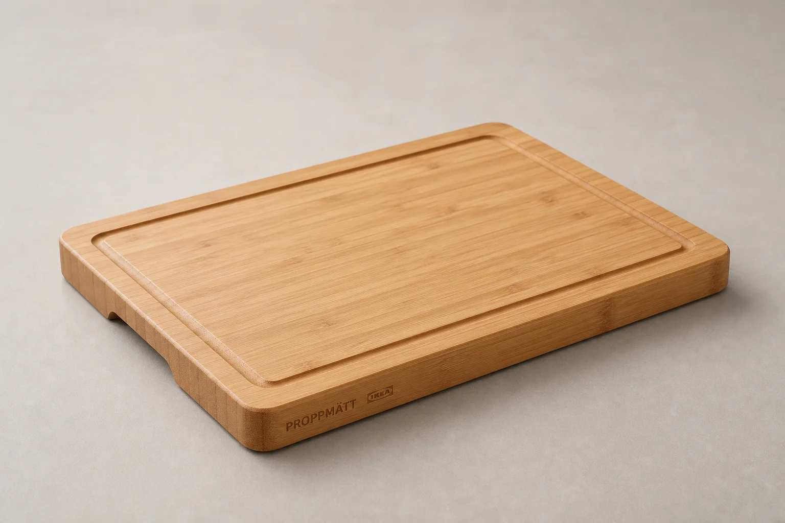Collection of IKEA camping products including bowls, cutting boards, storage bags, and accessories on concrete