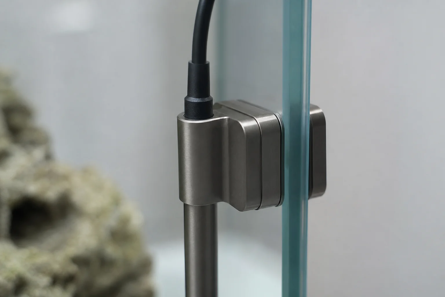 Magnetic mount securing heating element to aquarium glass panel